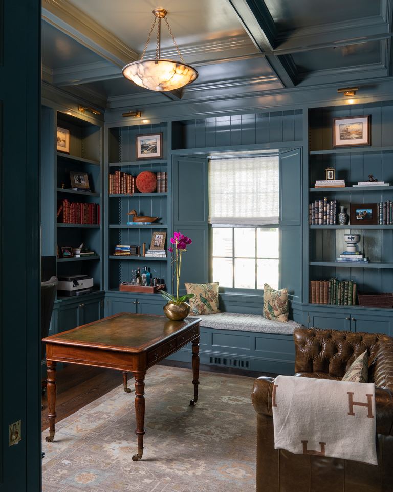 Book-lined study painted deep blue