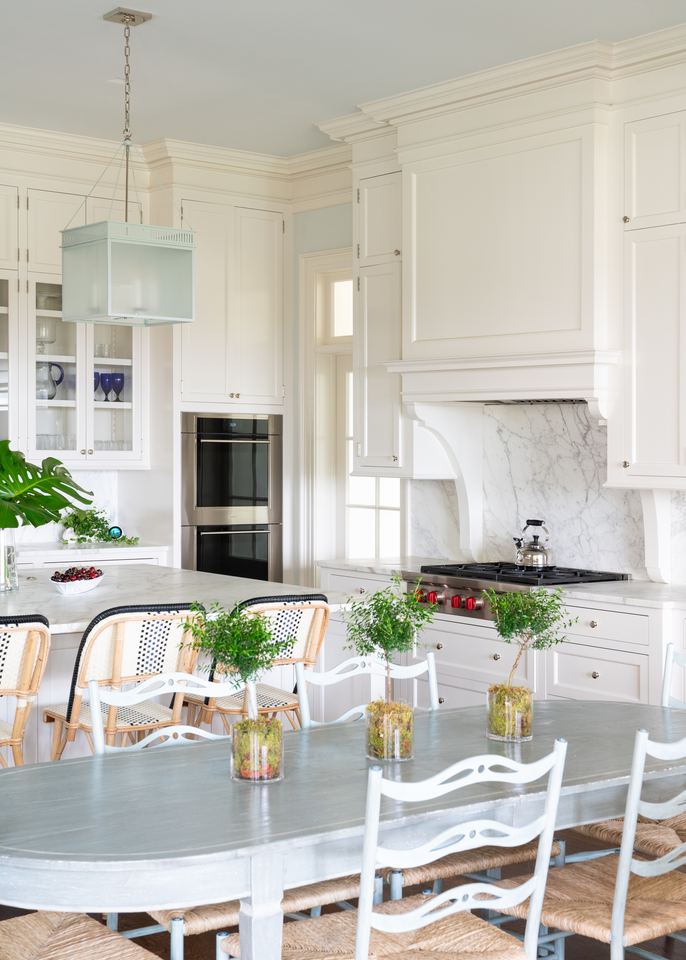 White kitchen with a long table