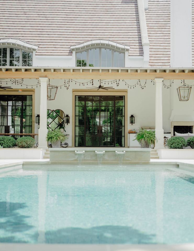 Pool and timber loggia across the rear of the house