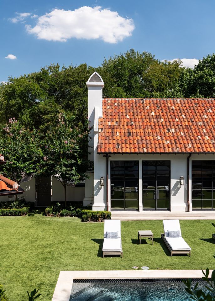 Tile-roofed wing with steel windows facing the lawn