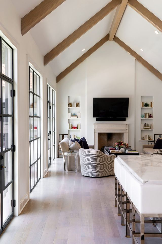 Vaulted living room lined with steel windows