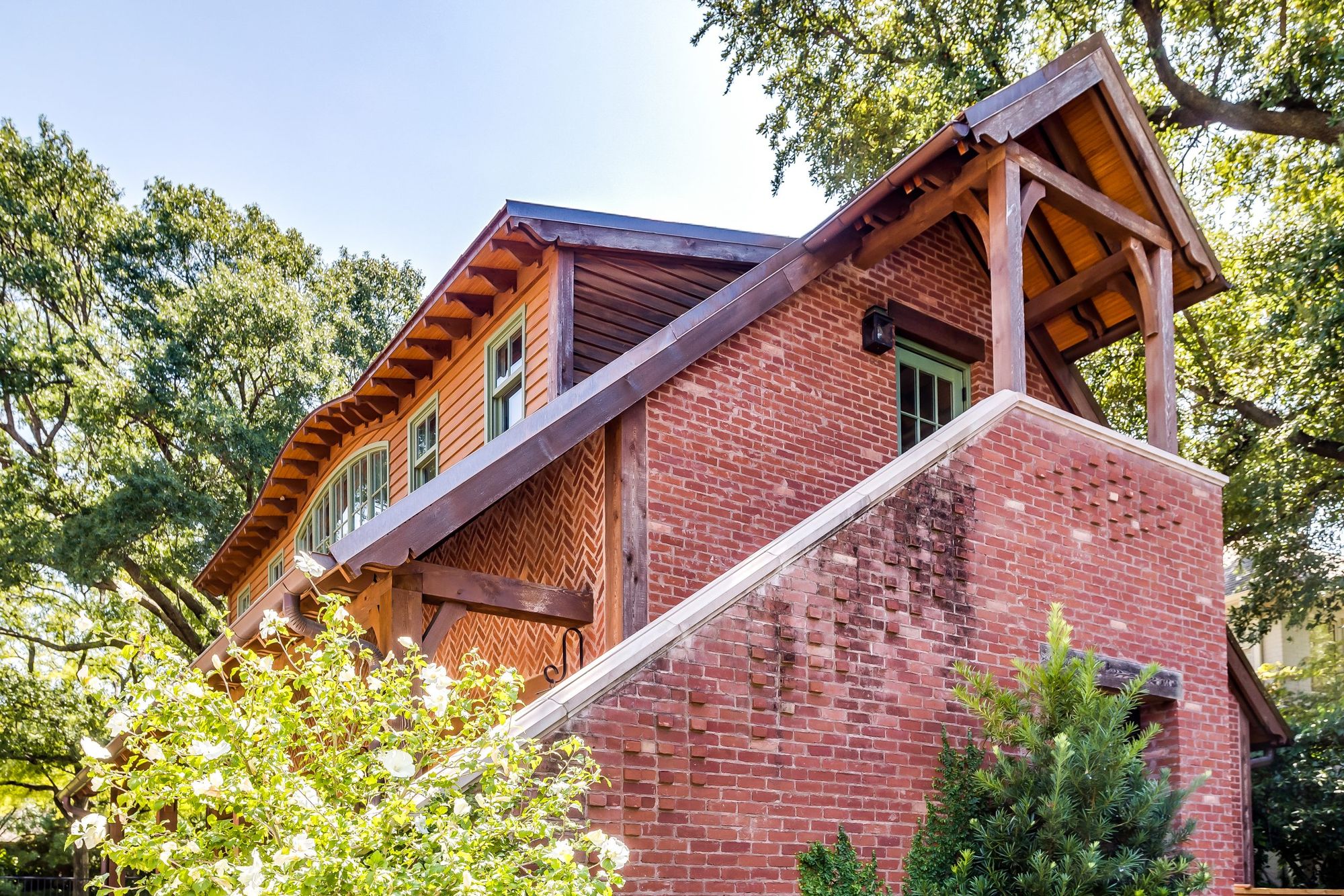 Brick wall and timber gable with deep cedar eaves