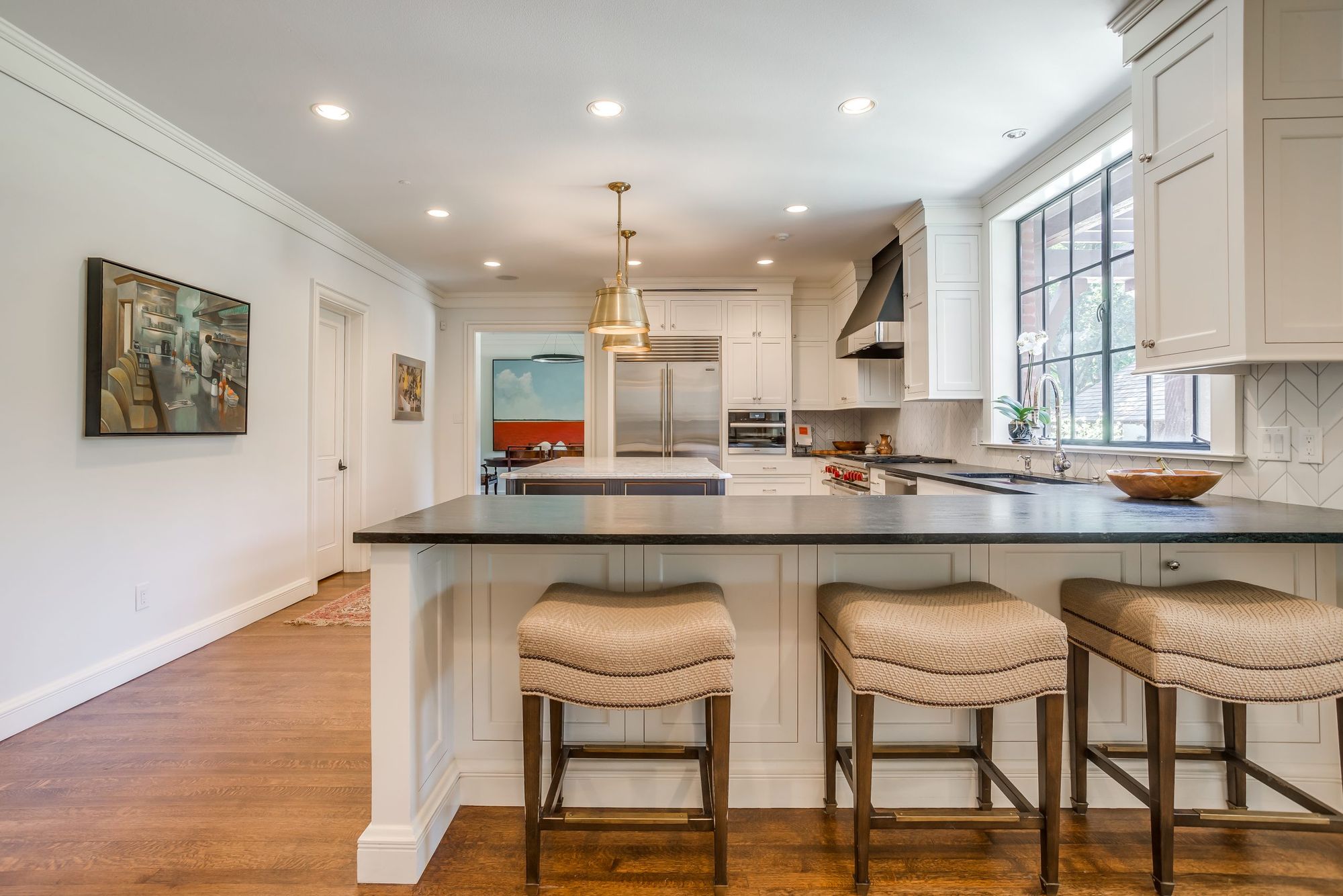 Kitchen with island and bar stools