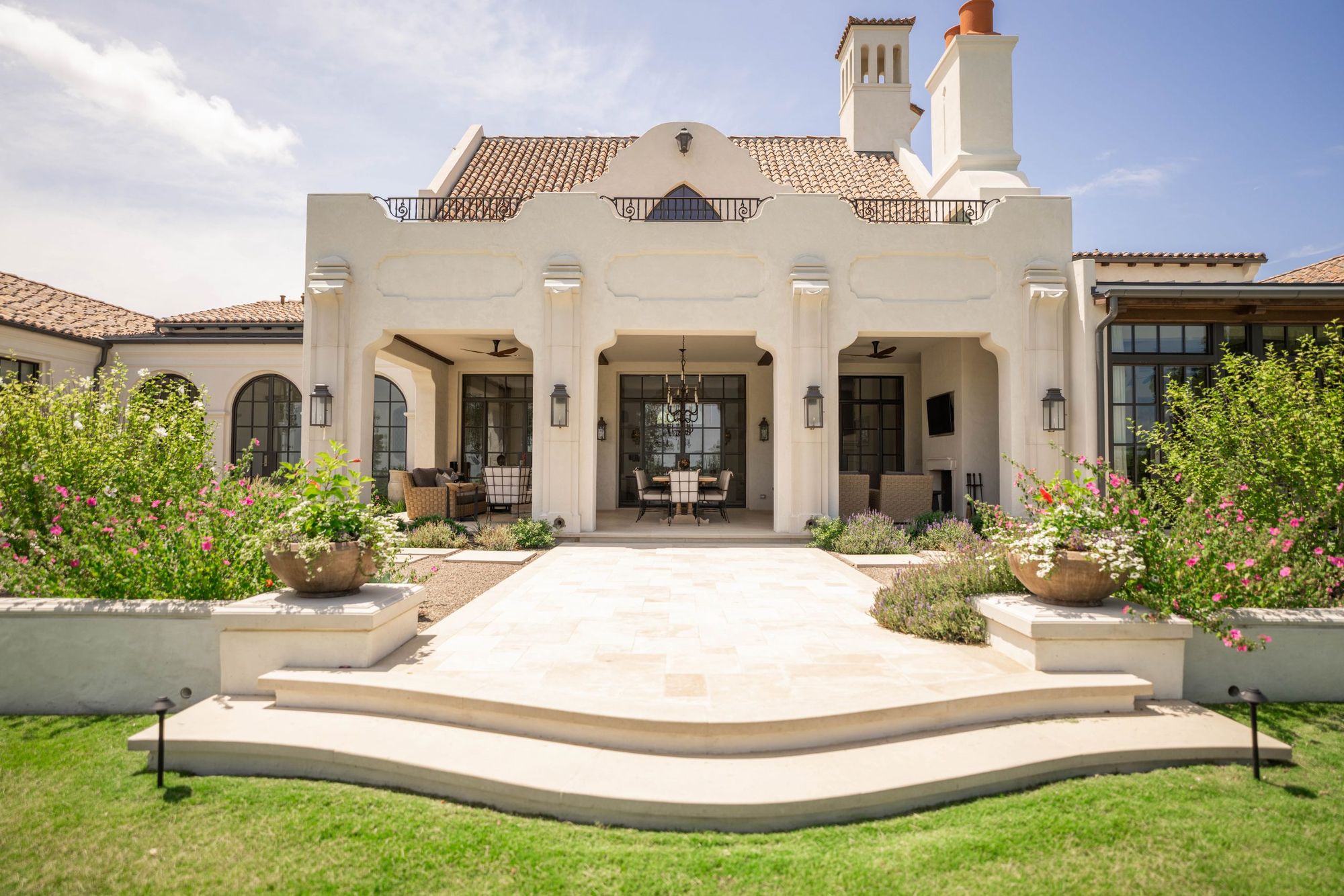 Rear terrace and arched loggia across the garden front